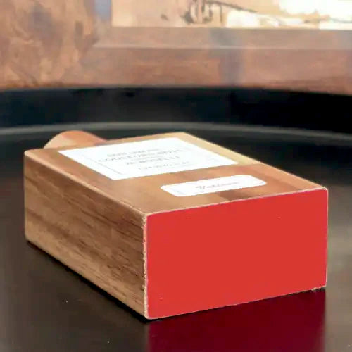 Boselli No. 10 Vétiver · Beech wood flacon lying flat, red base visible, with label | LaPeNu